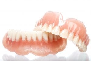 False teeth made from acrylic with white background