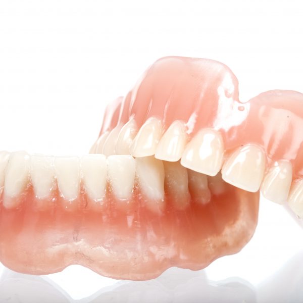 False teeth made from acrylic with white background